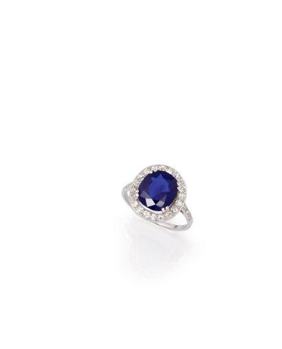 null Ring set with an oval sapphire in a setting of

8/8 old cut diamonds.

Platinum...