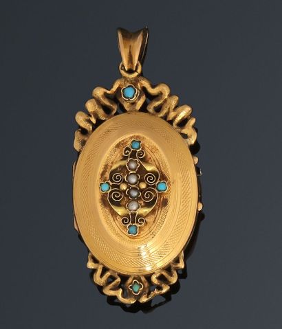 Yellow gold oval opening medallion pendant,...
