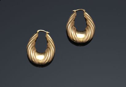 
Pair of pear-shaped earrings in yellow gold...