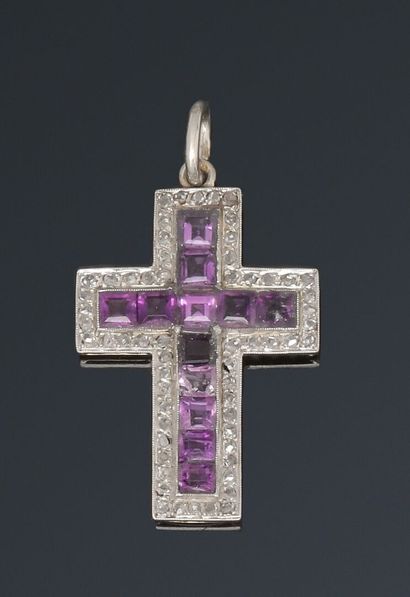 Cross pendant with lines of calibrated amethysts...