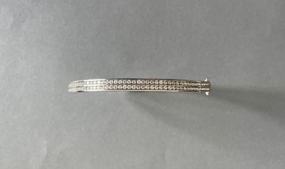 Rigid silver bracelet decorated with two...