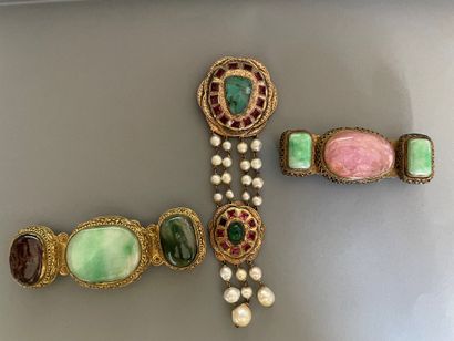 null Lot including a brooch and two belt buckles in gilded metal, fine stones and...