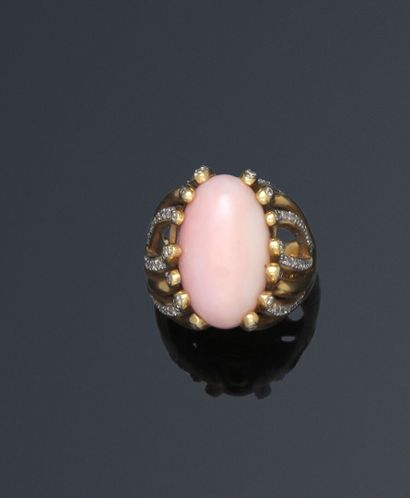 null Ring set with a coral cabochon, the claws extended into branches on the setting,...