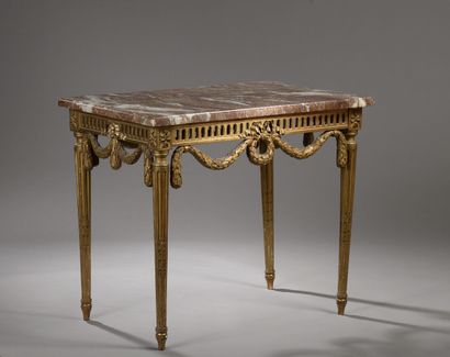 null Rectangular table, carved and gilded wood, the openwork belt carved with laurel...