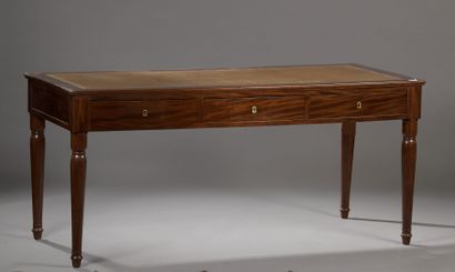 null Flat desk in mahogany and mahogany veneer the belt opening to three drawers,...