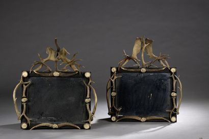 null Pair of mirrors, rectangular with a frame made of deer antlers.

Work in the...