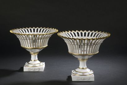 null Paris

Pair of round openwork porcelain baskets resting on a square base with...