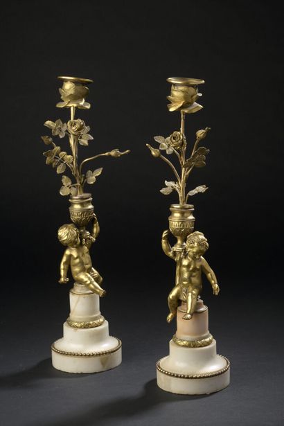 Pair of ormolu torches representing a young...