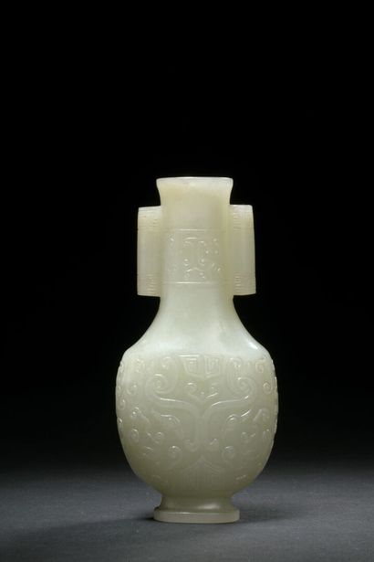 null CHINA - 18th century

Small nephrite vase carved with archaic decoration in...