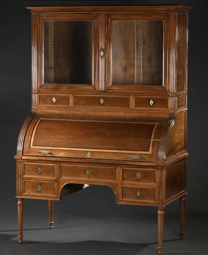 null Secretary cylinder bookcase in molded mahogany, opening with seven drawers,...