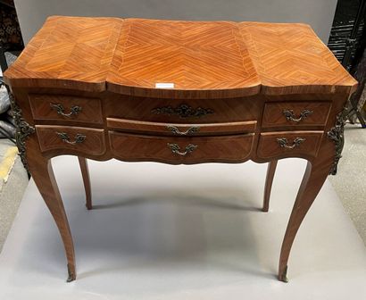 null Dressing table in wood veneer opening to three flaps a shelf and a drawer, cambered...