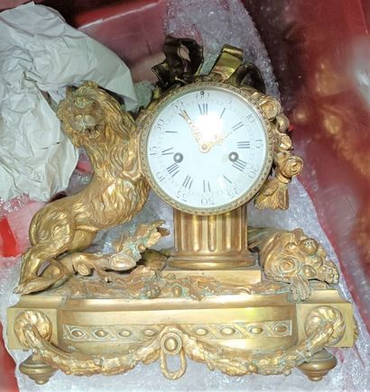null Important gilt bronze clock, the dial on a fluted column flanked by a lion....