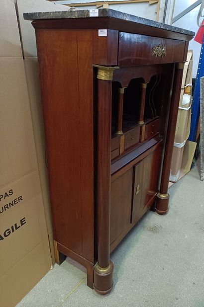 null Straight secretary in mahogany veneer, the amounts with column, a drawer in...