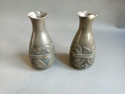  Pair of pewter vases with foliage decoration....