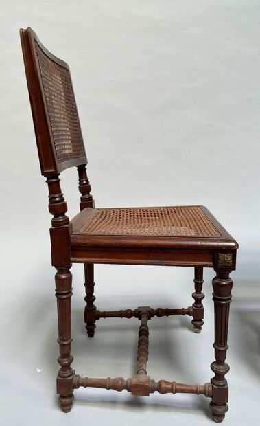 null Pair of chairs in molded and carved wood, the four legs joined by a turned wooden...