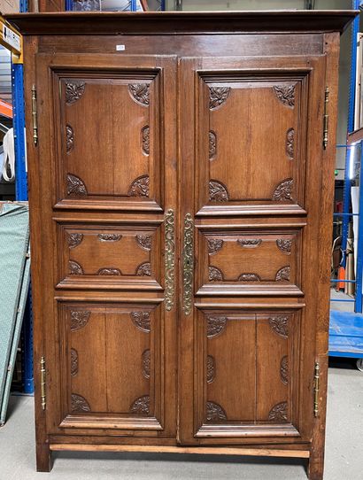  Oak cabinet carved with foliage. Partly...