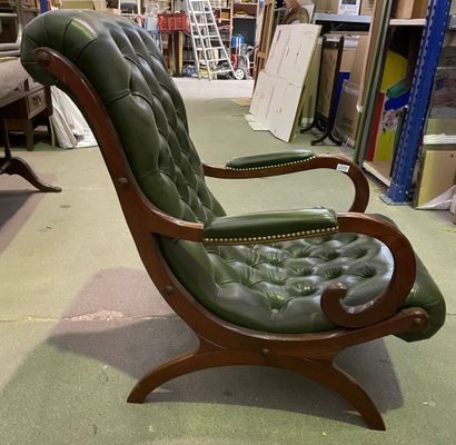 null Comfortable armchair with reversed back upholstered in green leather 

English...