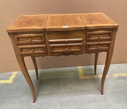 null Dressing table in fruit wood opening to three flaps and a pull, cambered legs.

Provincial...