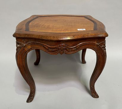  Stool in molded wood and carved with flowers,...