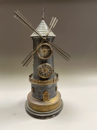 Clock forming a mill in brass and pewter...