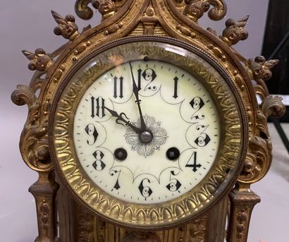 null Gilded bronze clock of architectural form, the dial under an arch topped by...