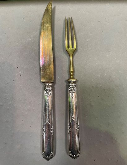 null Twelve forks and twelve fruit knives, the handle in silver chased with shell...