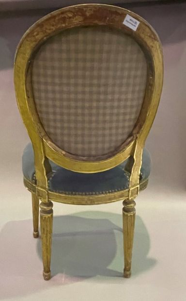 null Chair with medallion back in gilded wood and carved with a frieze of curls,...