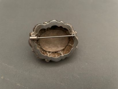 null Foreign silver brooch chased with pomegranates and fruits and decorated in its...