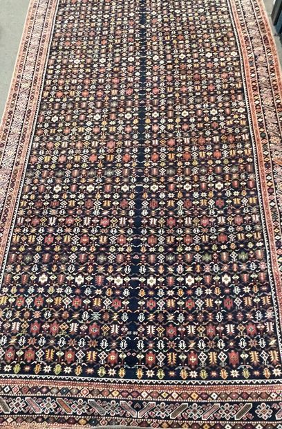 Large wool carpet with blue background and...