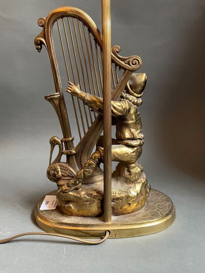 null 
Gilded bronze lamp stand "Young harpist".

Signed on the back Georges OMER

Total...