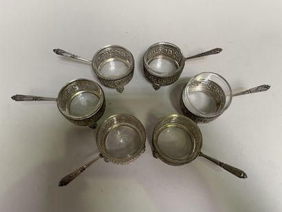 null Six silver saltcellars with openwork scrolls and side handles, glass interior.

Weight...