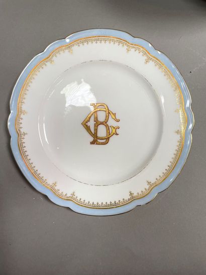 null Part of a table service in porcelain with sky blue and gold nets, numbered BC,...