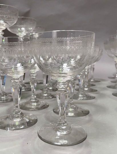 null Part of service of glasses with feet out of glass engraved of a frieze of loops...