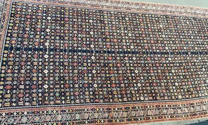 null Large wool carpet with blue background and stylized motifs

510 x 230 cm

W...