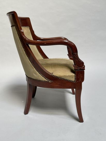 null Mahogany armchair, the armrests carved with dolphin heads,

Directoire style

82...