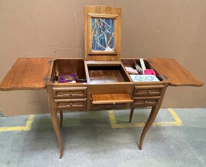 null Dressing table in fruit wood opening to three flaps and a pull, cambered legs.

Provincial...