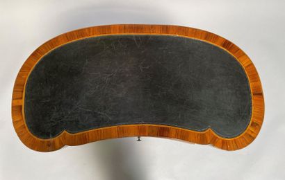 null Table kidney in wood veneer opening to a drawer in belt, the base joined by...