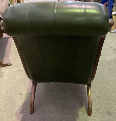 null Comfortable armchair with reversed back upholstered in green leather 

English...