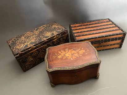 null Set of three wooden boxes: 

-The first one with geometric decoration of rosettes...