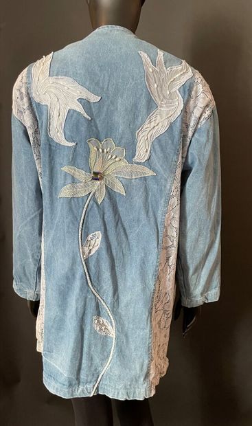 null ANONYMOUS 

Oversized denim jacket enhanced with lace and rhinestone applications...