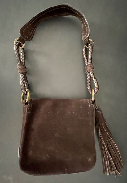 null Emmanuel UNGARO

Brown suede mini bag embellished with a pompom, shoulder strap,...