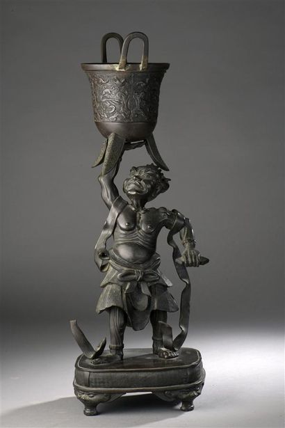 null 
JAPAN, MEIJI period.




Sage carrying a tripod vase with one hand. Subject...