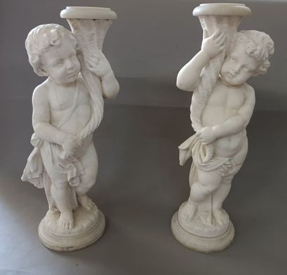 
Pair of white marble saddles carved with...