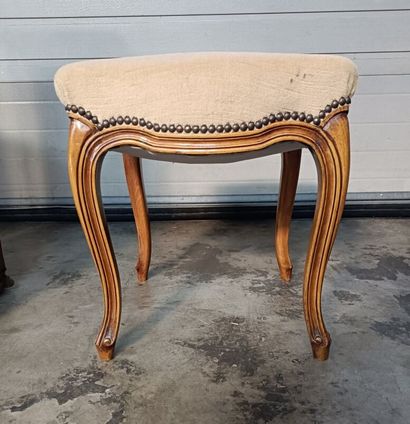 Wooden stool upholstered in beige fabric...