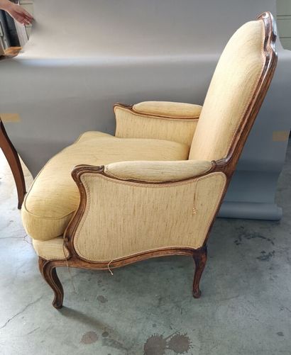 null Pair of armchairs upholstered in yellow fabric and framed in molded wood. 

Accidents.

94...