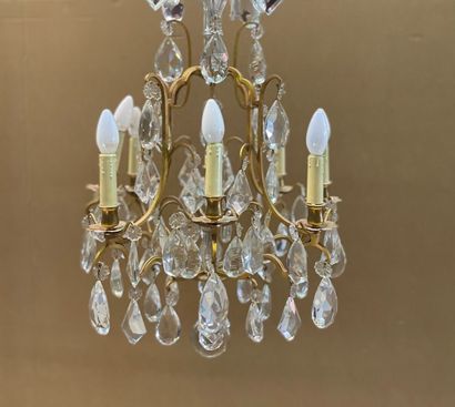 A gilt bronze cage chandelier with eight...