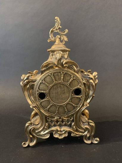 null 
Gilt metal clock and its bracket, violin shape with rocaille decoration of...