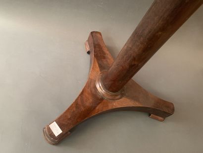 null Small mahogany veneered pedestal table with a central shaft resting on a tripod...