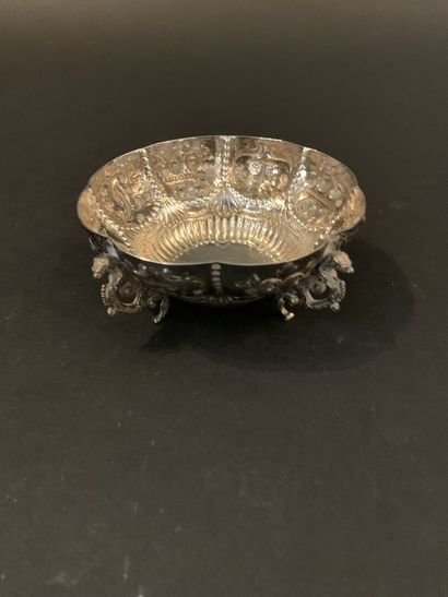 
A richly decorated silver bowl resting on...