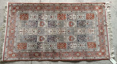 null 
Wool and silk carpet Hereke decorated with flowered boxes. 




Iran.




156...